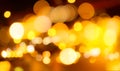 Blur gold color bokeh background. Blur abstract background of city light. Warm light with beautiful pattern of round bokeh. Orange