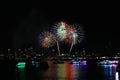 blur green red gold fireworks on beach and reflection color on water surface