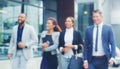 Blur, group and business people in city, walking and cooperation for project development. Professional, outdoor and Royalty Free Stock Photo