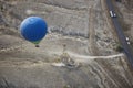 Blur hot air balloon flying over the road with motor transport Royalty Free Stock Photo