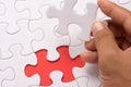 Blur image of close up of hand placing the last jigsaw puzzle pi Royalty Free Stock Photo