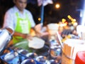Blur image of cooking egg Roti over hot pan with palm oil in old style, cooking Roti in a black hot pan, Blurred background cookin