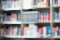 Blur image of shelf with books in library. Background