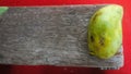 Blur image of unripped maggo on wooden board Royalty Free Stock Photo