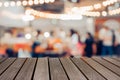 Blur image wood table on food court background.