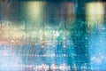 Blur light of bar or pub reflection on blue water swimming pool summer party at night background Royalty Free Stock Photo