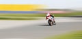 Blur motion of motorcycle racer on a track Royalty Free Stock Photo