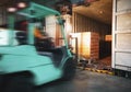 Blur Motion of Workers Driving Forklift Loading Cargo Pallets into Container Trucks. Shipping Warehouse. Delivery Service Shipment Royalty Free Stock Photo