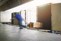Blur Motion of Workers Unloading Package Boxes on Pallets Out of The Container Trucks. Shipping Warehouse. Delivery Service Royalty Free Stock Photo