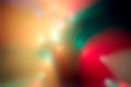 Blur multicolored abstract bokeh background on black background. Defocused abstract multicolored retro or disco light.