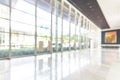 Blur office or hotel lobby background interior view toward reception hall, modern luxury white room space with blurry corridor Royalty Free Stock Photo