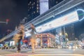 Blur pedestrians crossing busy zebra crossing road at night Royalty Free Stock Photo