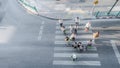 Blur people are moving across the pedestrian crosswalk