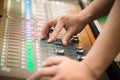 Blur Photo Hand adjusting audio mixer. sound engineer hands working on sound mixer in live concert. Royalty Free Stock Photo