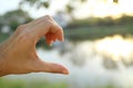 Blur photo of one hand show half of heart Royalty Free Stock Photo