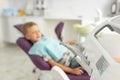 Blur picture. Cute small boy is visiting dentals doctor. The kid is sitting in medical chair Royalty Free Stock Photo