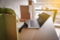 Blur picture of green shopping paper bag with laptop