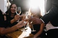 Blur portrait of smiling girls drinking wine in sunny day and talking around. Photo of relaxed women with male hands