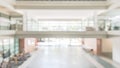 Blur school or educational office building interior background in empty hallway indoor area with corridor, glass wall blurry view Royalty Free Stock Photo
