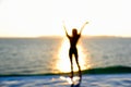 blur silhouette of women happy holding hands on the tropical beach in sunrise or sunset time Royalty Free Stock Photo