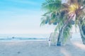Blur summer sea with palm tree and beach chair and copy space,sky relaxing concept,beautiful tropical background for travel Royalty Free Stock Photo