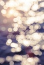 Blur sunset beach with bokeh sun light wave abstract background. Royalty Free Stock Photo