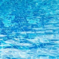 Blur swimming pool water background with wavy reflective blue tile underwater in cool blue color Royalty Free Stock Photo