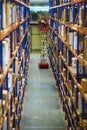 Blur warehouse background. Warehouse worker taking package in the shelf in a large warehouse in a large warehouse Royalty Free Stock Photo