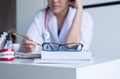 Blur of young woman doctor is thingking and tired with working at hospital