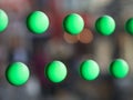 Blurred green circles on a shinny sliver surface. Abstract background. Royalty Free Stock Photo