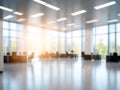 Blured modern office interior with warm sunlight and floor reflections