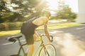 Young male cyclist riding a road bike in summer day. Action, motion concept Royalty Free Stock Photo