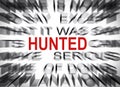 Blured text with focus on HUNTED