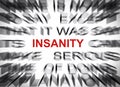 Blured text with focus on INSANITY Royalty Free Stock Photo