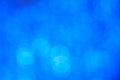 Blurred abstract background, bokeh of blue circles close-up