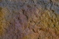 Blurred abstract background. Brown with yellow tuberous cement surface