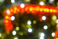 Blurred abstract background of Christmas lights.Brightly glowing yellow-orange balls and lines.Abstract color patterns Royalty Free Stock Photo