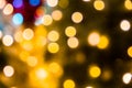 Blurred abstract background of Christmas lights.Brightly glowing yellow-orange balls and lines.Abstract color patterns Royalty Free Stock Photo