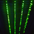 Blurred abstract background of green server lamps, bokeh light lights in a row Royalty Free Stock Photo