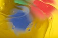 Blurred abstract background. Image of red, blue, green and yellow circles and wavy lines of different sizes. Royalty Free Stock Photo