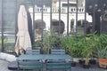 Blurred abstract background of outdoor cafe or restaurant. Outdoor cafe with tables and chairs. Street cafe in the evening in