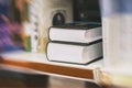 Blurred abstract background of Two thick volumes Fiction in book store, in library. Concept of education, school, study