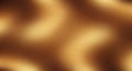 Blurred abstract background of warm golden brown tones with soft flowing shapes and subtle light variations creating Royalty Free Stock Photo