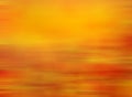 Blurred and abstract fall or sunset background with colorful linear red and orange linear autumn colored. Royalty Free Stock Photo