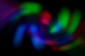 Blurred abstract gradient wave green, pink, blue, blurry christmas and holiday lights background. Multicolored, bright spiral Royalty Free Stock Photo