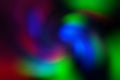 Blurred abstract gradient wave green, pink, blue, blurry christmas and holiday lights background. Multicolored, bright spiral