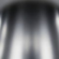 A blurred, abstract image featuring smooth gradients of gray and black tones. The texture appears Royalty Free Stock Photo