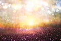 blurred abstract photo of light burst among trees and glitter golden bokeh lights. Royalty Free Stock Photo
