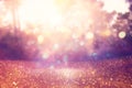 blurred abstract photo of light burst among trees and glitter golden bokeh lights. Royalty Free Stock Photo