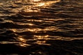 Blurred abstracted sun flare, sunset light on water surface